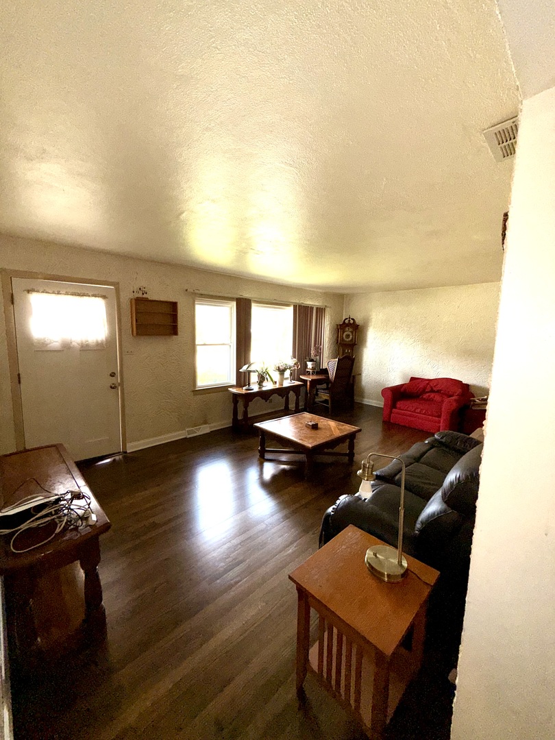 10741 Mason Avenue Chicago Ridge, IL 60415 - Photo 4 of 23 a living room with furniture and wooden floor