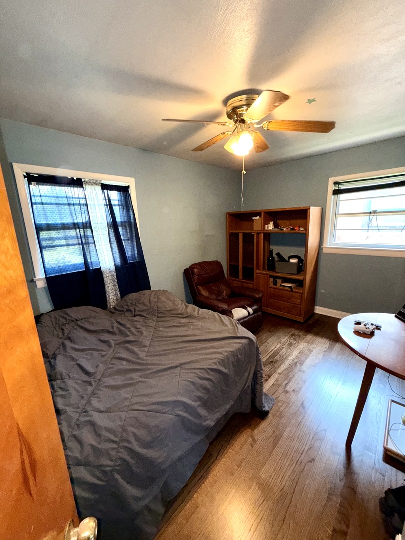 10741 Mason Avenue Chicago Ridge, IL 60415 - Photo 7 of 23 a bedroom with a bed and window
