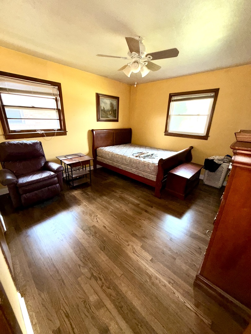 10741 Mason Avenue Chicago Ridge, IL 60415 - Photo 9 of 23 a bedroom with a bed and window