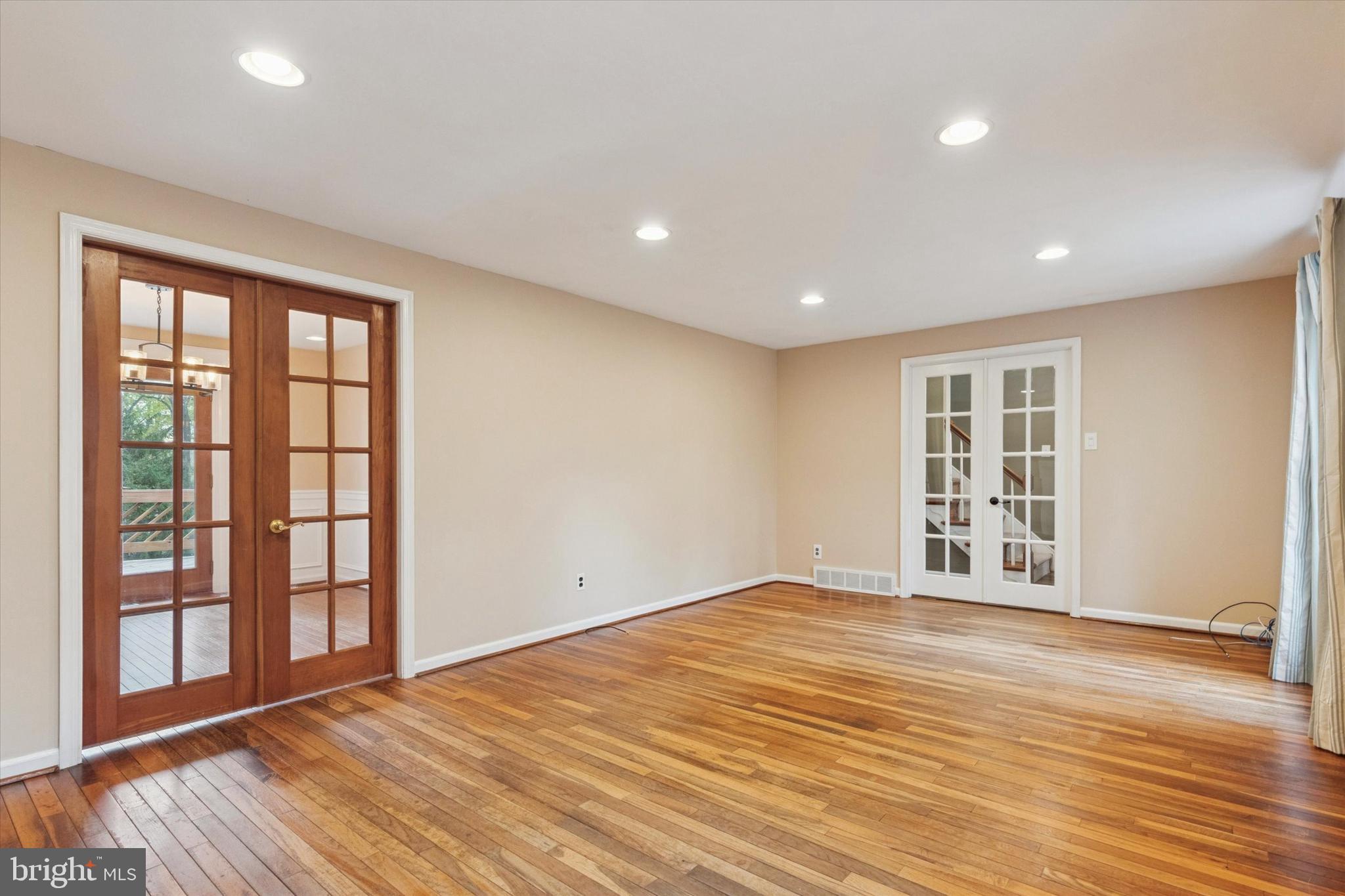 685 Hopewell Road Downingtown, PA 19335 - Photo 11 of 39 a view of an empty room with wooden floor and a window