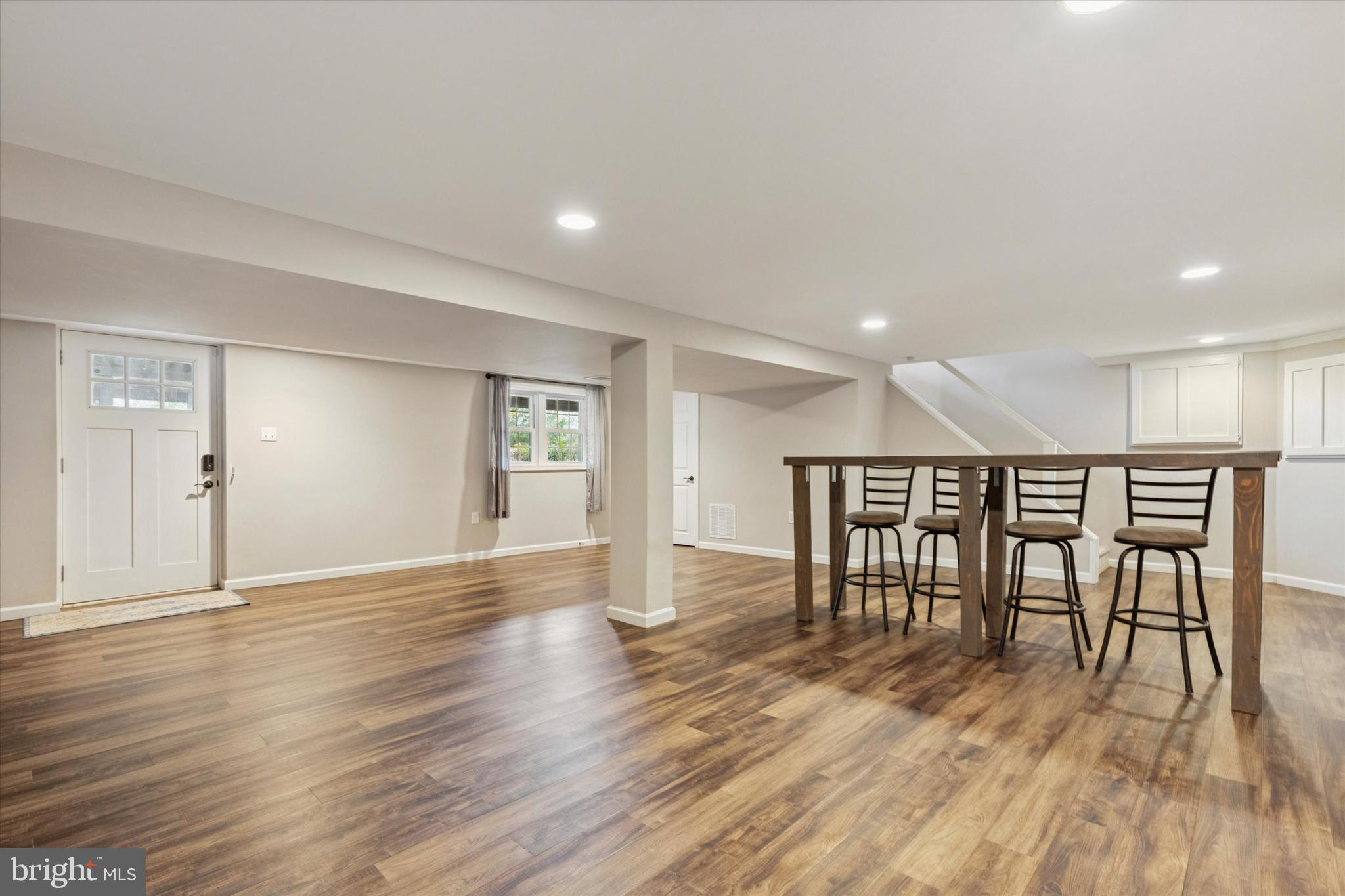 685 Hopewell Road Downingtown, PA 19335 - Photo 19 of 39 a view of an empty room with wooden floor and a window
