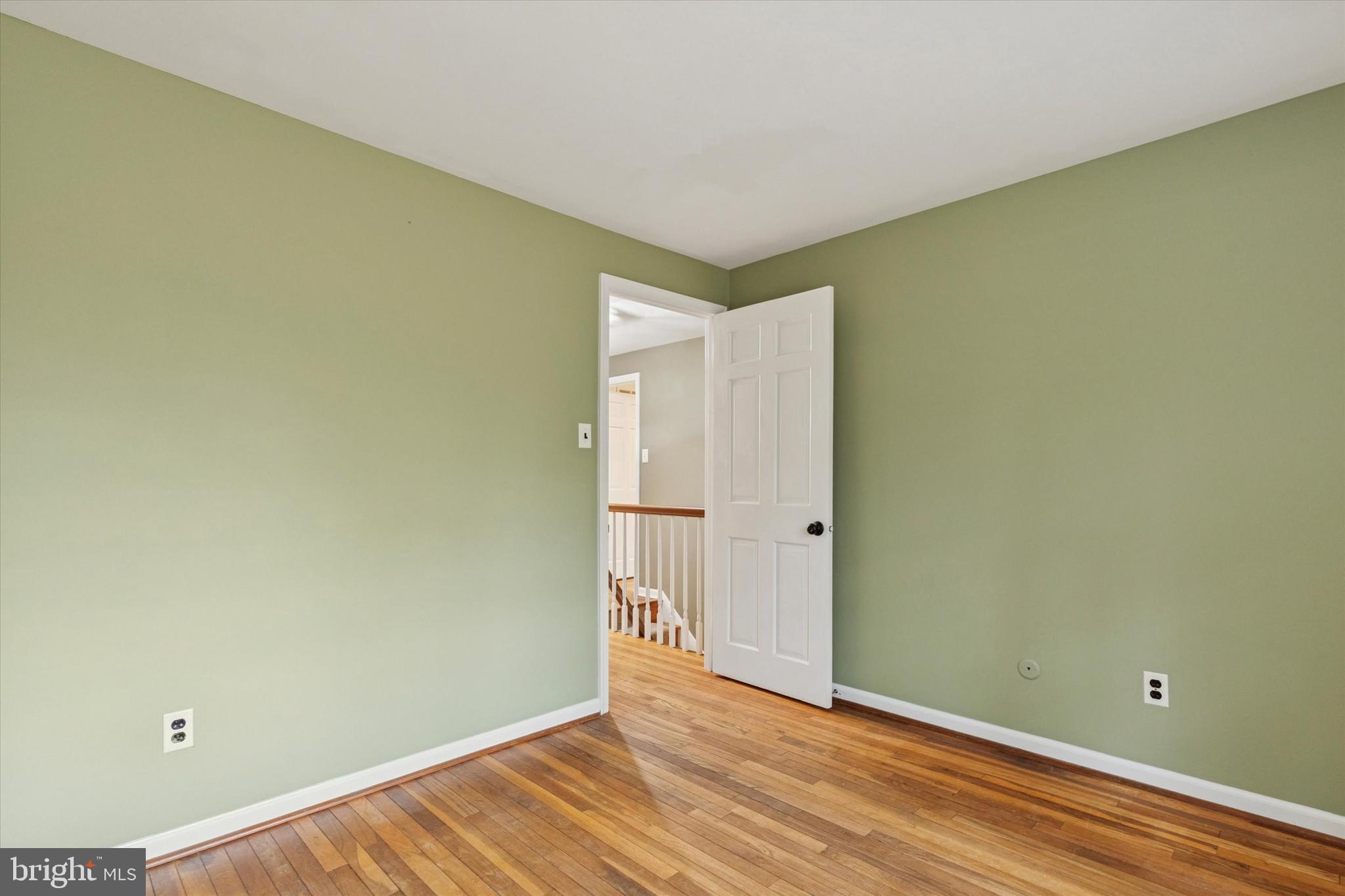 685 Hopewell Road Downingtown, PA 19335 - Photo 21 of 39 a view of an empty room with wooden floor