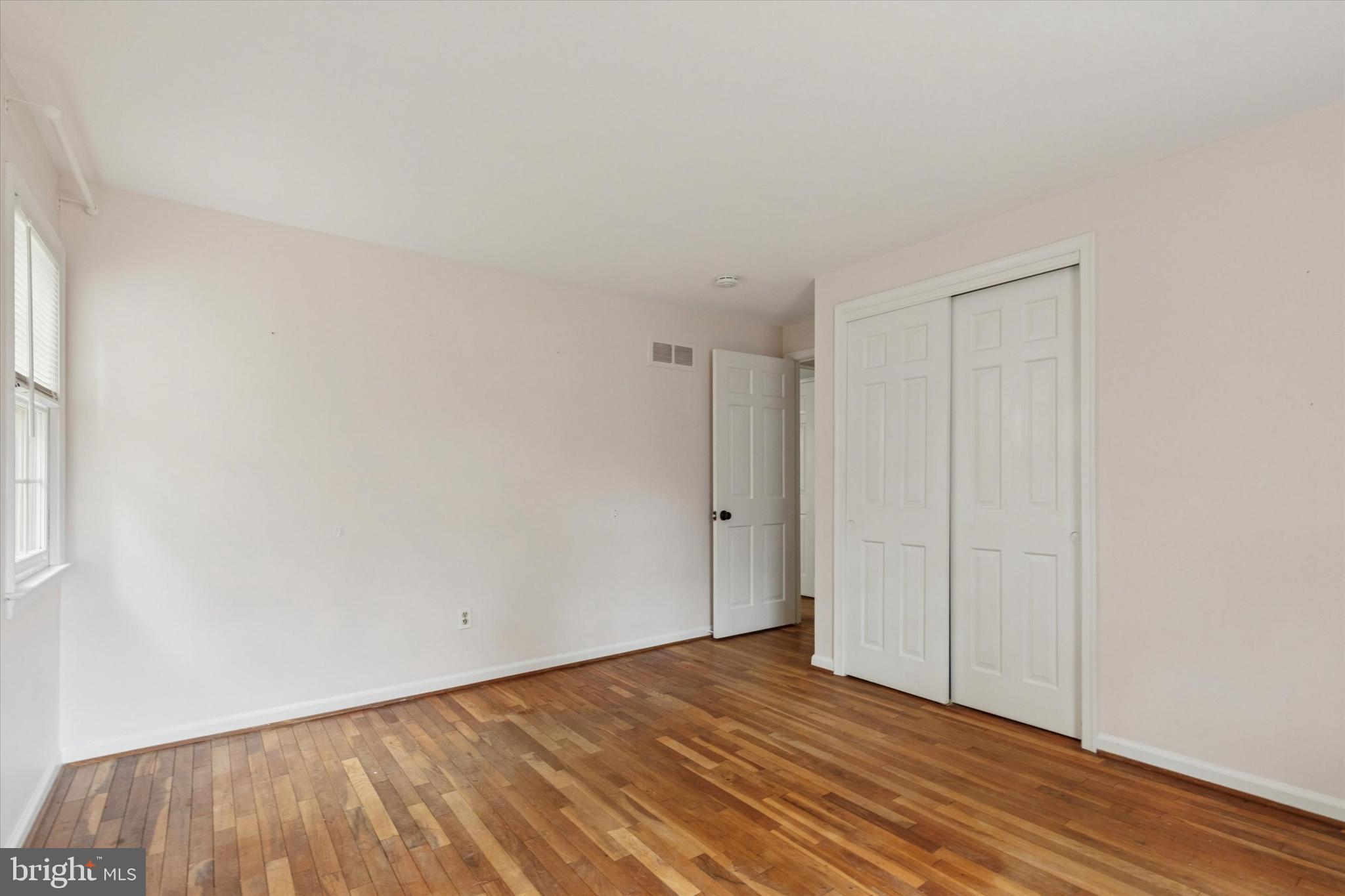 685 Hopewell Road Downingtown, PA 19335 - Photo 23 of 39 a view of an empty room with wooden floor