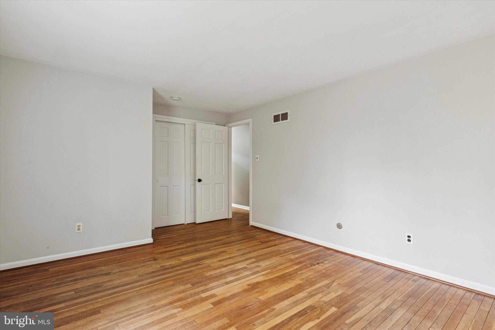 685 Hopewell Road Downingtown, PA 19335 - Photo 25 of 39 a view of an empty room with wooden floor