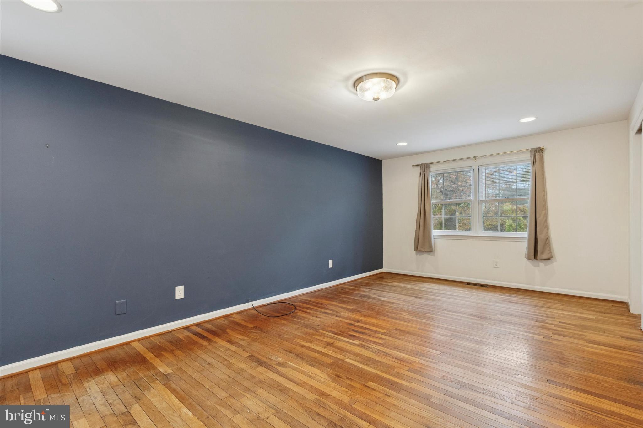 685 Hopewell Road Downingtown, PA 19335 - Photo 27 of 39 a view of an empty room with wooden floor and a window