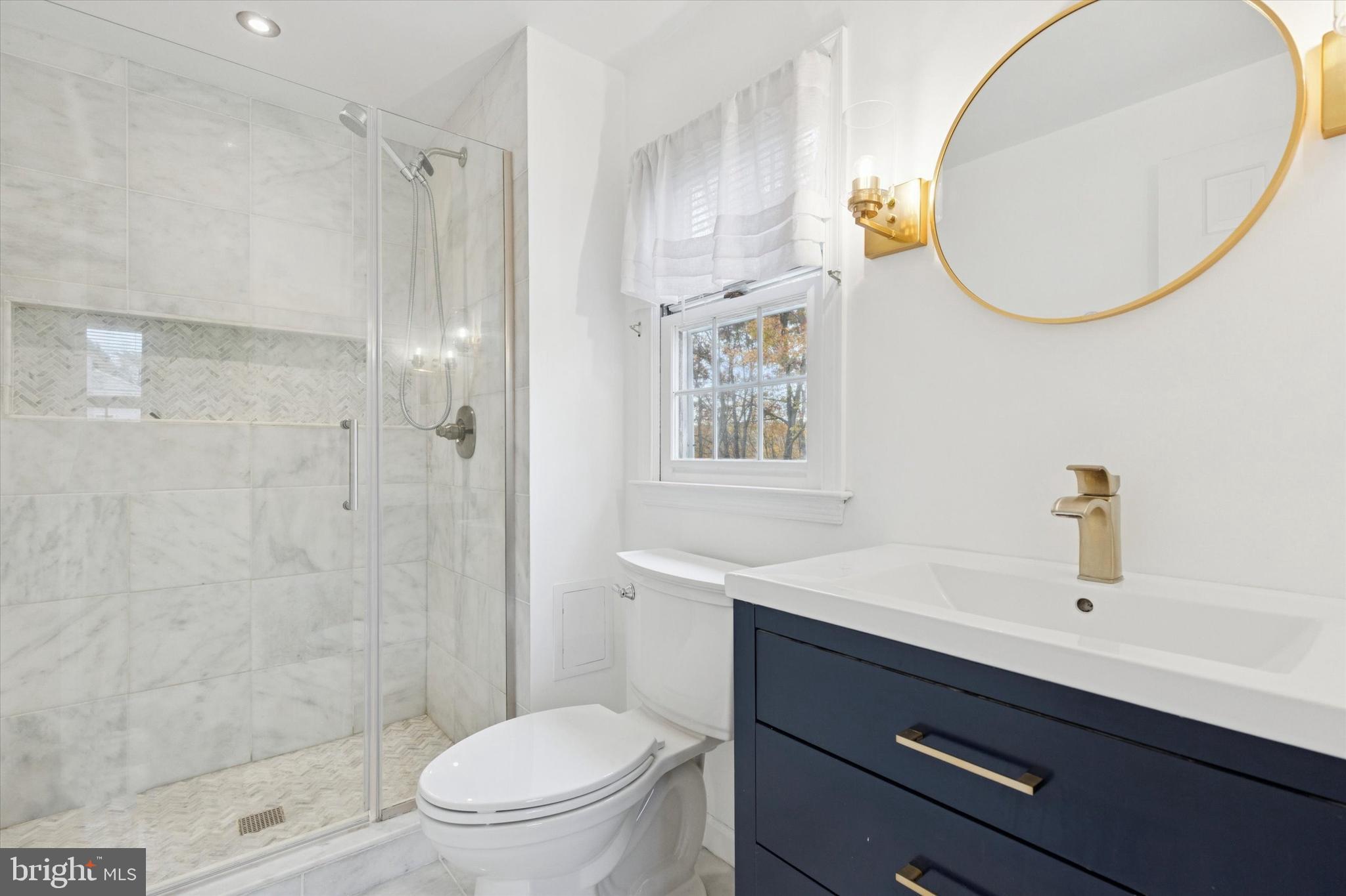 685 Hopewell Road Downingtown, PA 19335 - Photo 29 of 39 a bathroom with a sink a toilet and shower