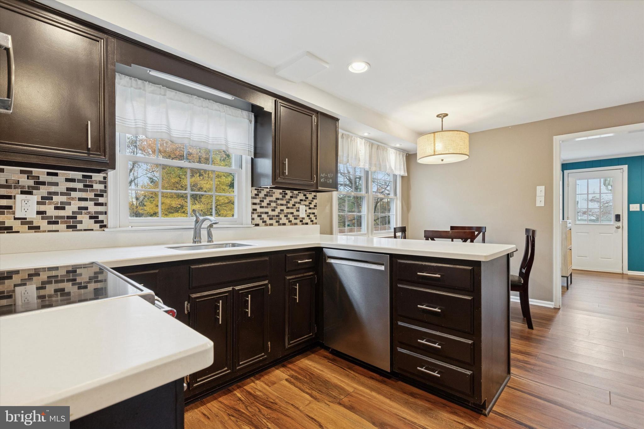 685 Hopewell Road Downingtown, PA 19335 - Photo 7 of 39 a kitchen with a sink stove and cabinets