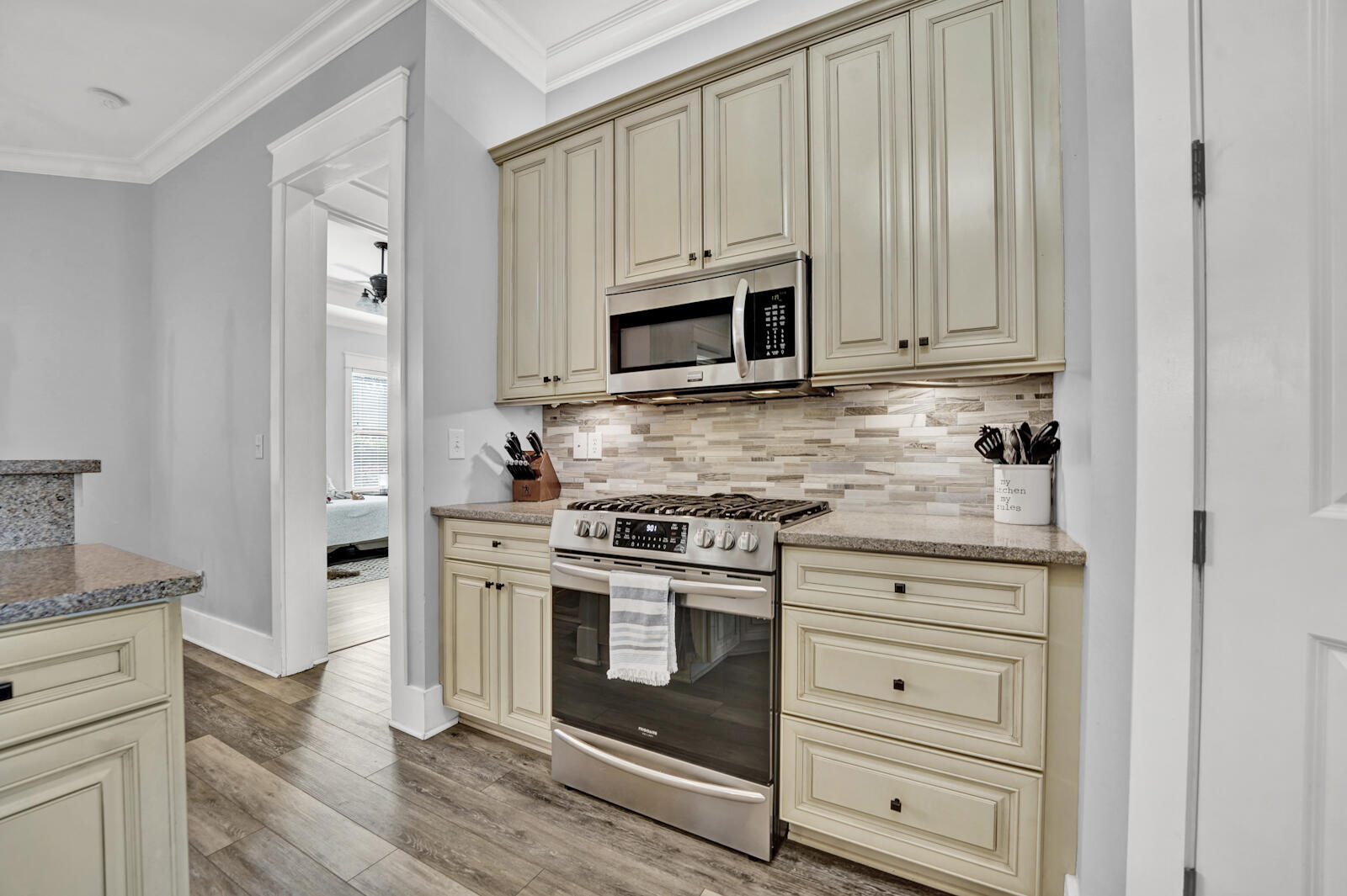 738 Symphony Way Freeport, FL 32439 - Photo 14 of 69 a kitchen with stainless steel appliances white cabinets and a stove a oven with white countertops