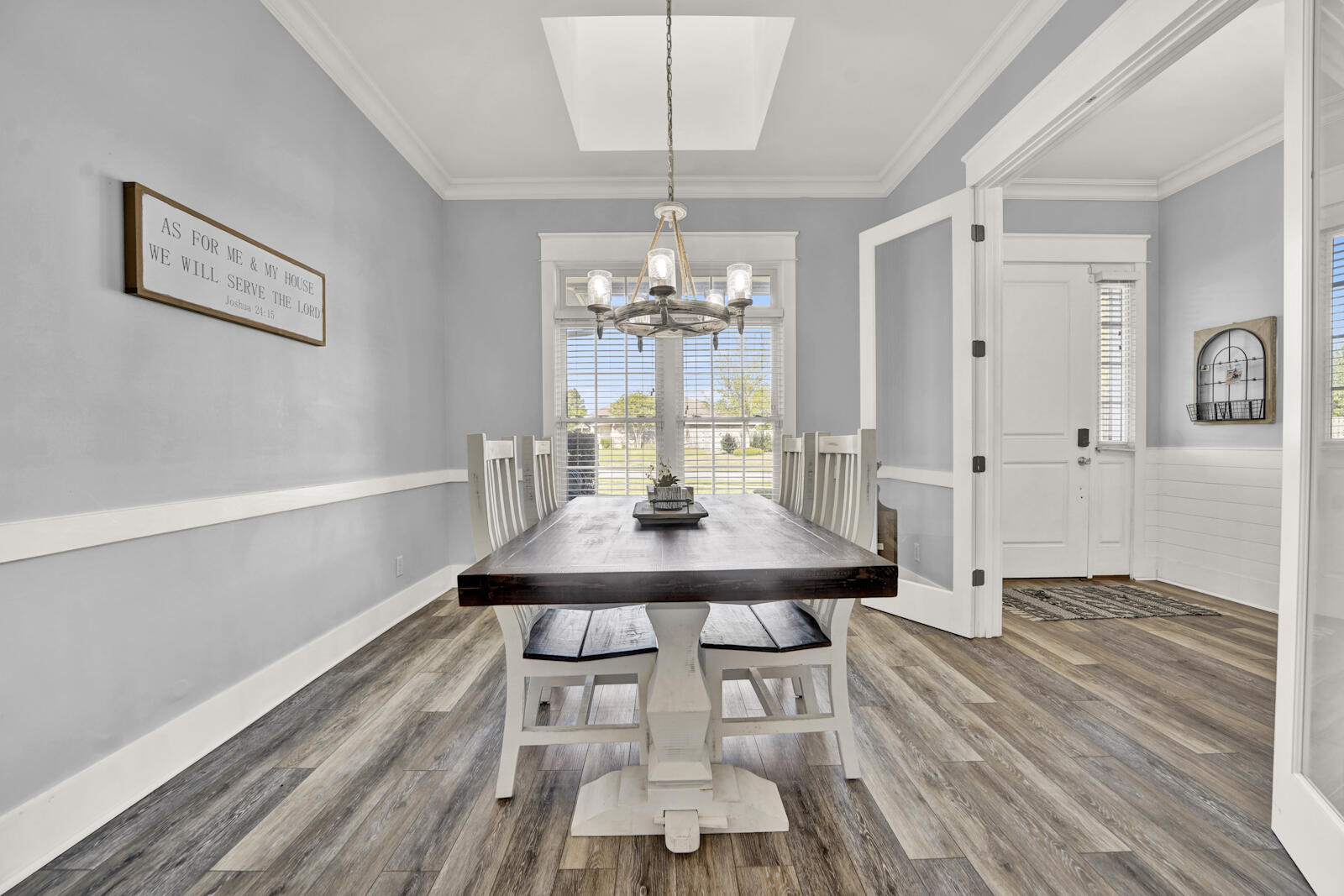 738 Symphony Way Freeport, FL 32439 - Photo 18 of 69 a view of a dining room with furniture and wooden floor