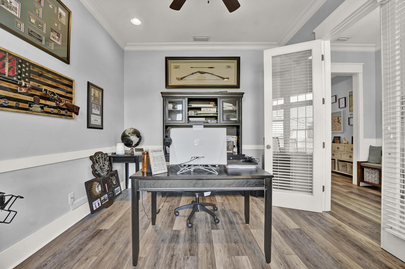 738 Symphony Way Freeport, FL 32439 - Photo 20 of 69 a view of a workspace with furniture and wooden floor