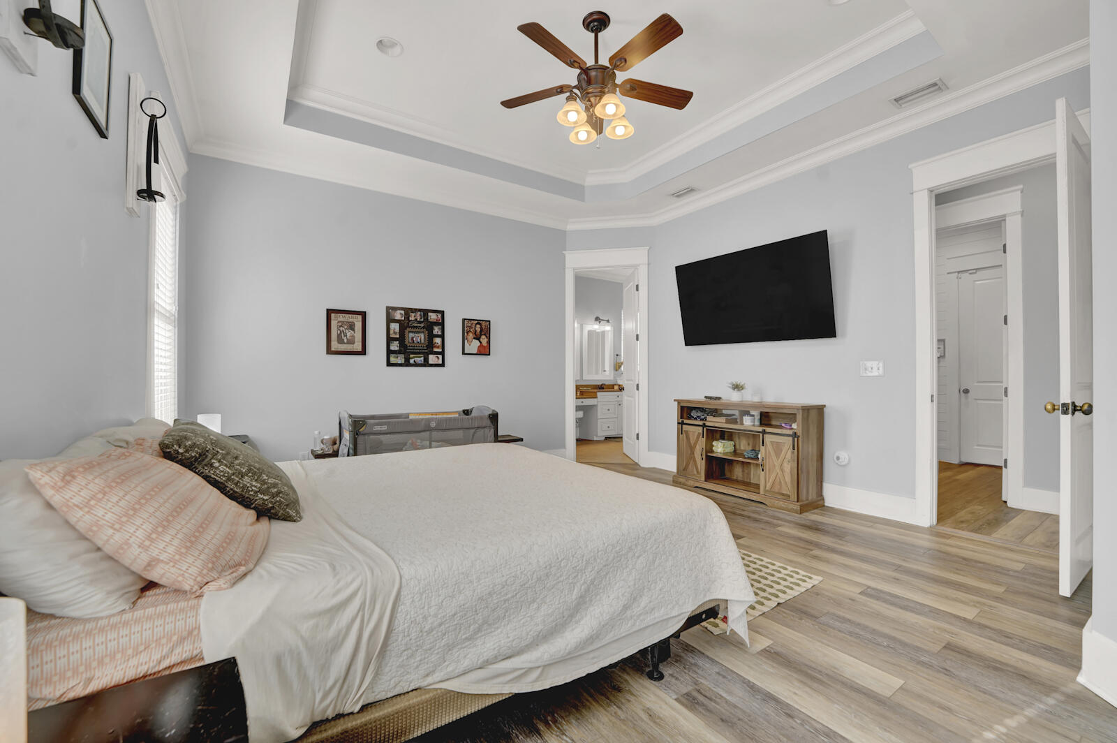 738 Symphony Way Freeport, FL 32439 - Photo 22 of 69 a bedroom with a bed and a flat screen tv