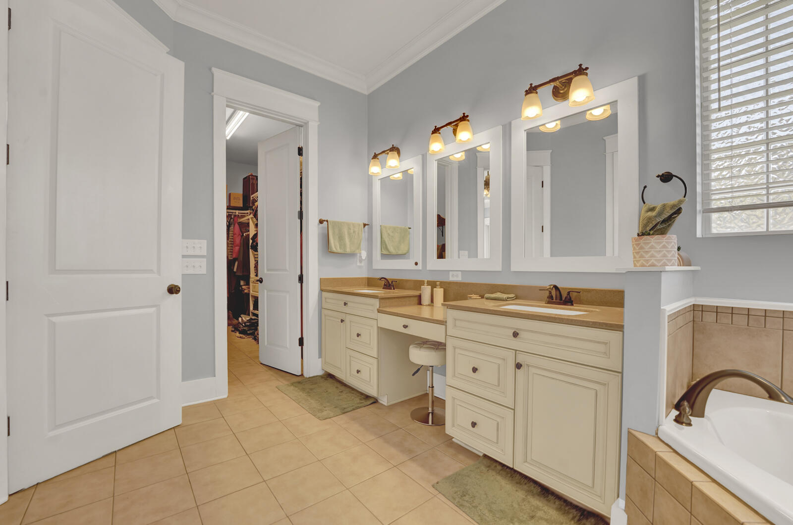 738 Symphony Way Freeport, FL 32439 - Photo 28 of 69 a spacious bathroom with a double vanity sink a mirror and a shower