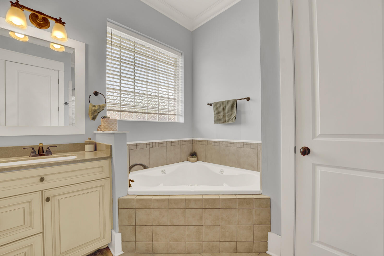 738 Symphony Way Freeport, FL 32439 - Photo 29 of 69 a bathroom with a sink a vanity and a mirror