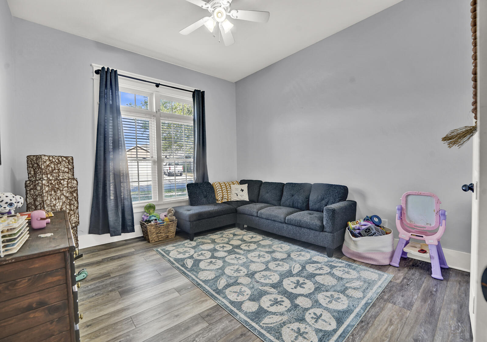 738 Symphony Way Freeport, FL 32439 - Photo 34 of 69 a living room with furniture and wooden floor