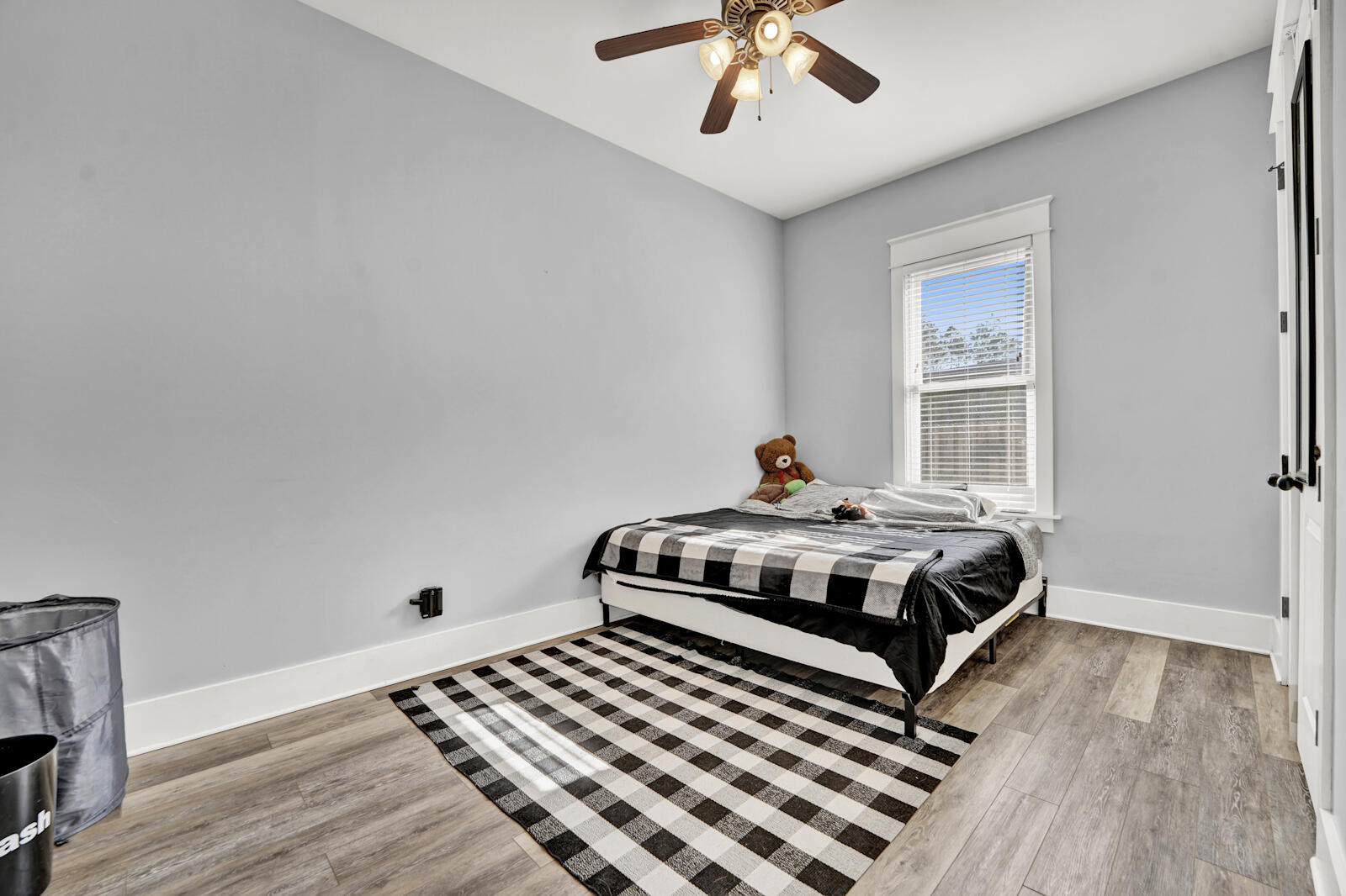 738 Symphony Way Freeport, FL 32439 - Photo 36 of 69 a bedroom with a bed and wooden floor