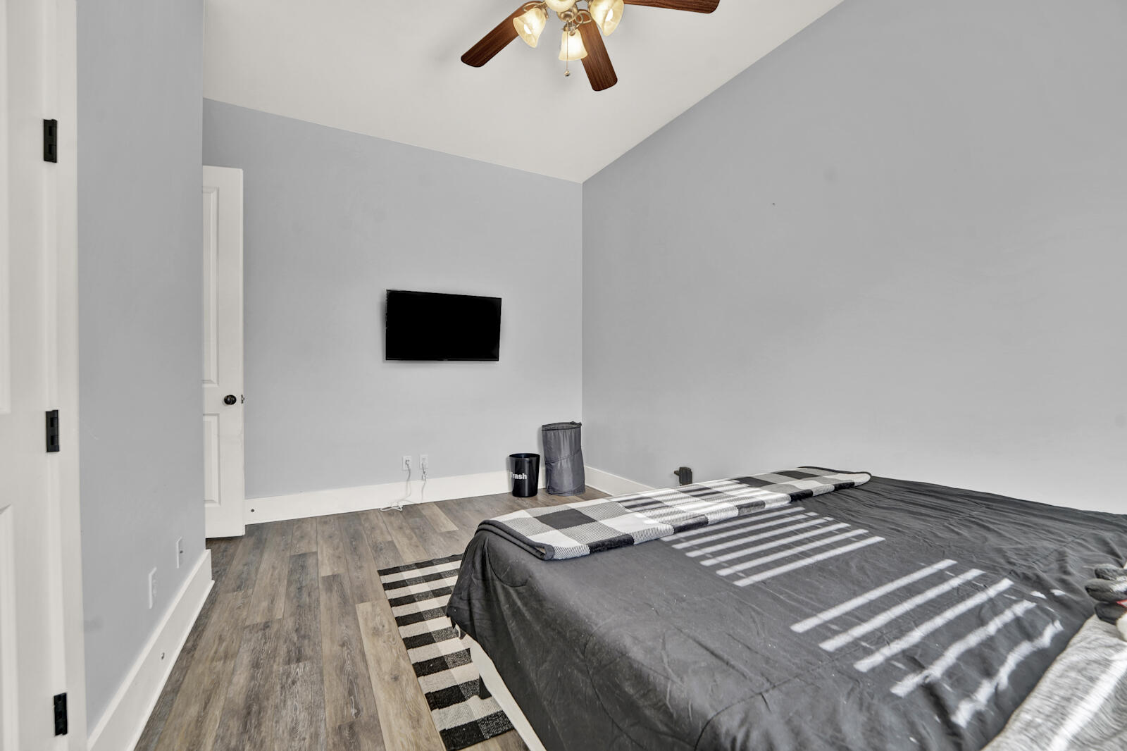 738 Symphony Way Freeport, FL 32439 - Photo 37 of 69 a bedroom with a bed and a flat screen tv