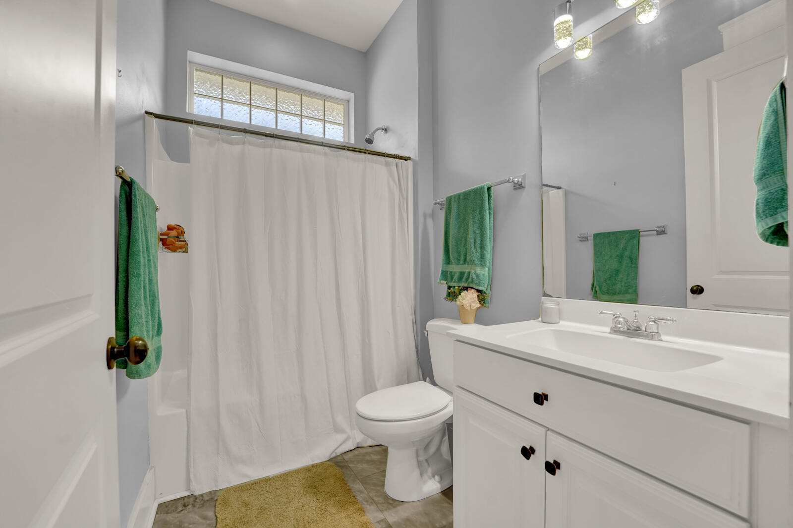 738 Symphony Way Freeport, FL 32439 - Photo 38 of 69 a bathroom with a sink a toilet and a mirror