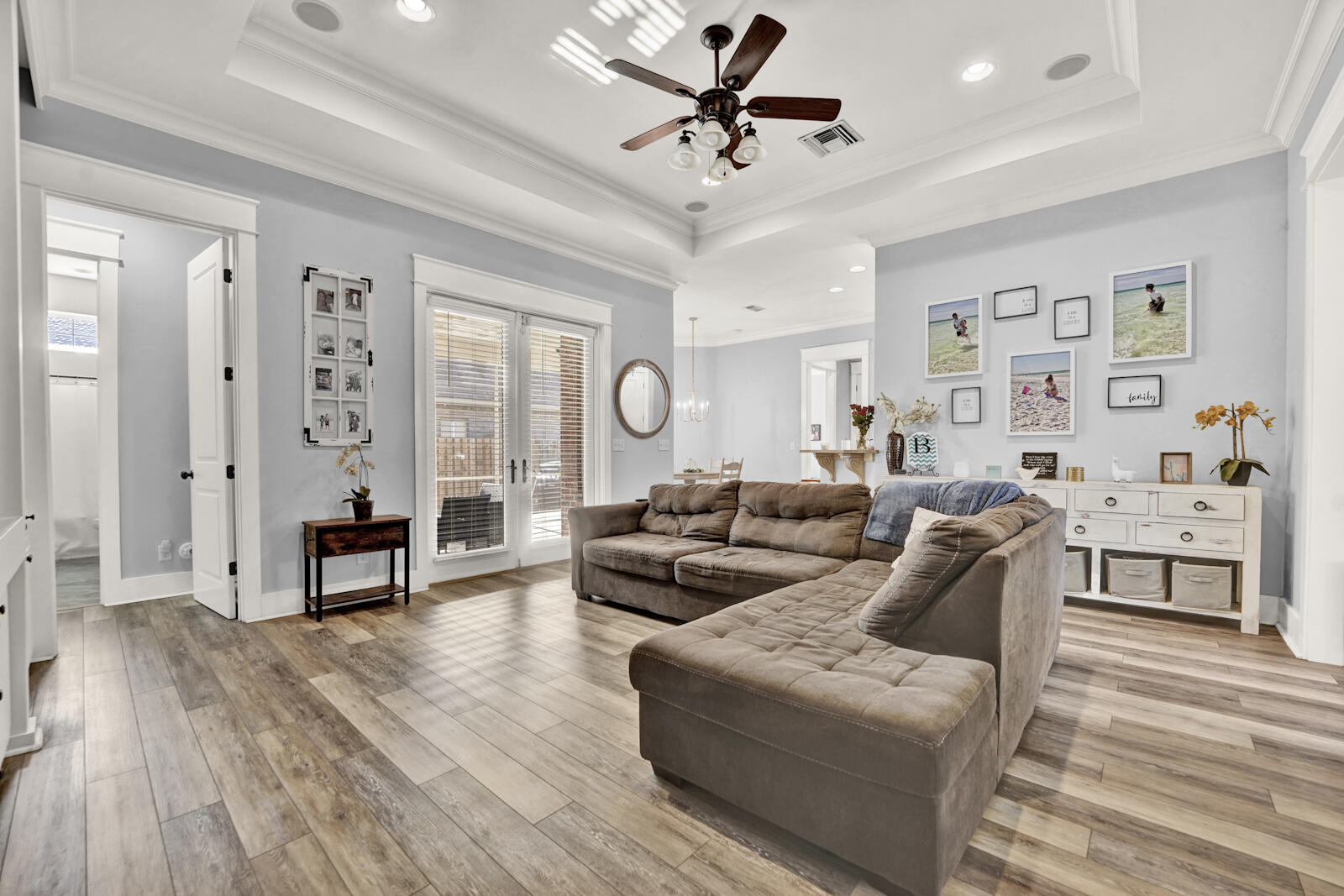 738 Symphony Way Freeport, FL 32439 - Photo 6 of 69 a living room with furniture white walls and wooden floor