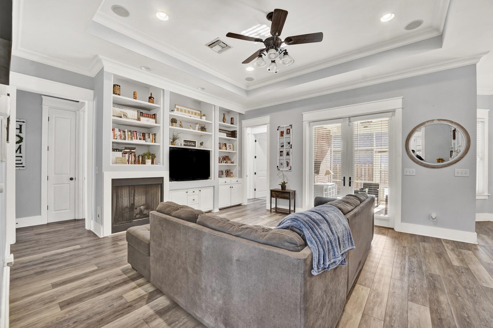 738 Symphony Way Freeport, FL 32439 - Photo 7 of 69 a living room with furniture a flat screen tv and a fireplace