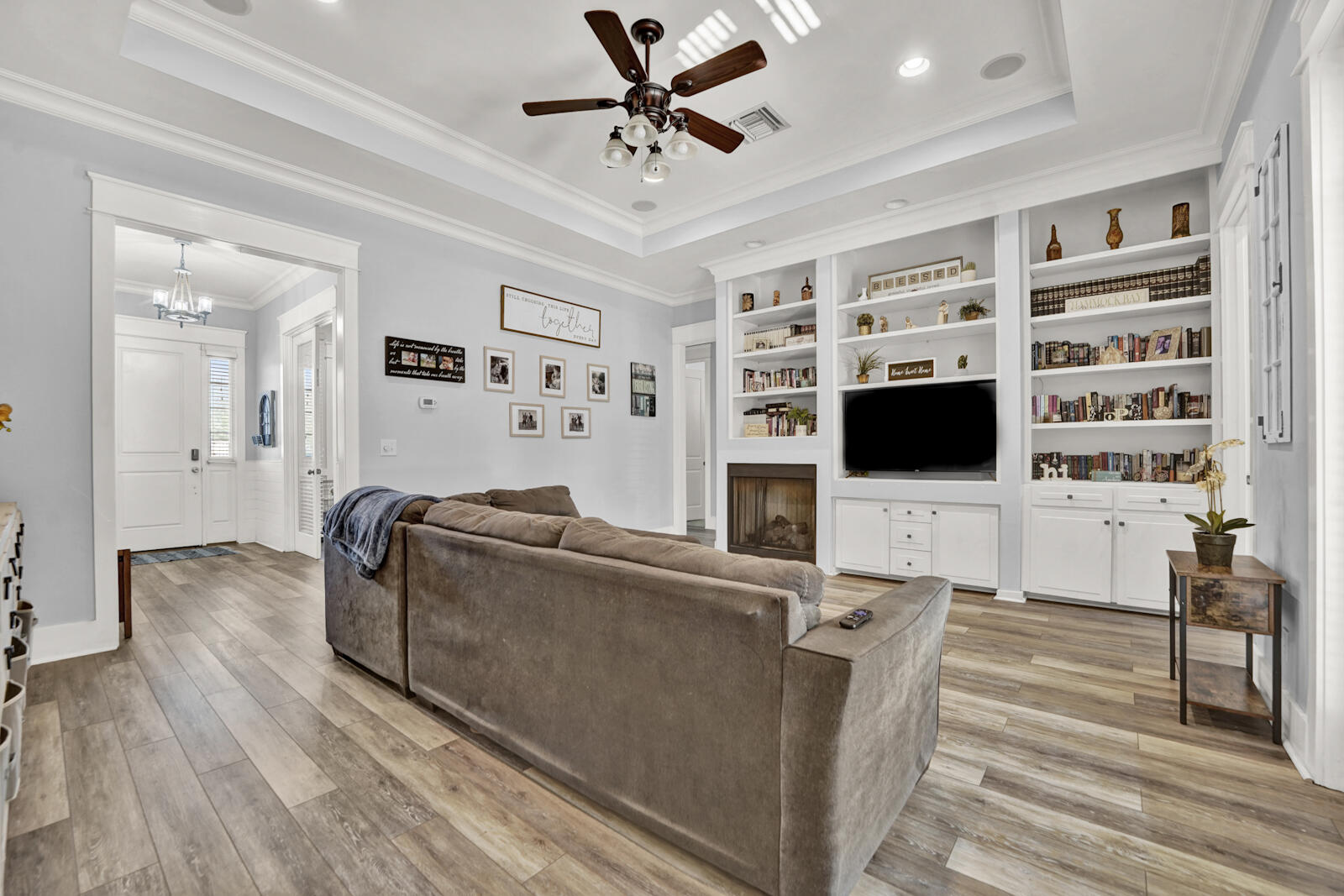 738 Symphony Way Freeport, FL 32439 - Photo 8 of 69 a living room with furniture and a flat screen tv