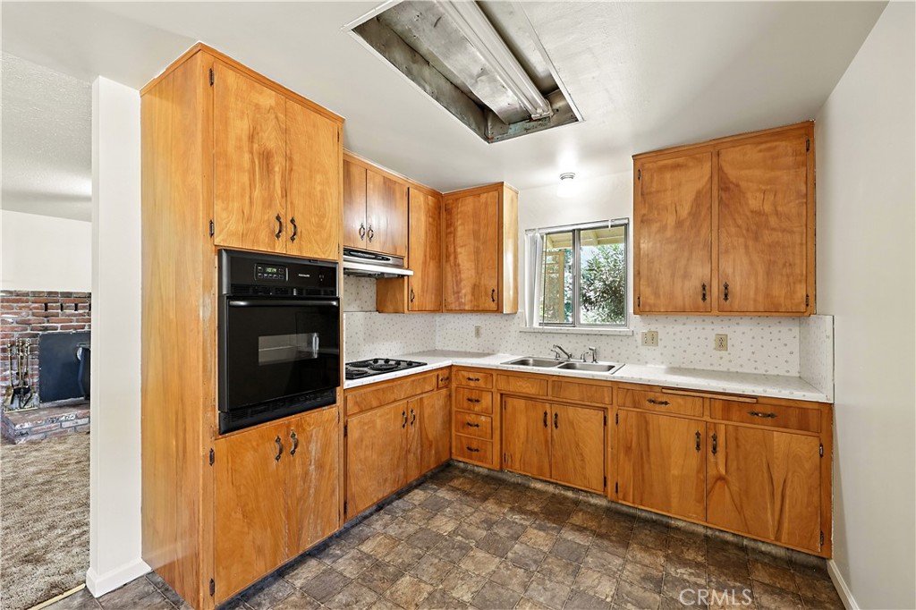 6345 Merced Falls Road Snelling, CA 95369 - Photo 14 of 54 a kitchen with a sink and cabinets
