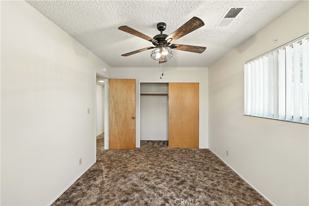 6345 Merced Falls Road Snelling, CA 95369 - Photo 16 of 54 a view of a livingroom with a ceiling fan and window