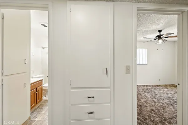 a view of a livingroom with wooden floor and a window