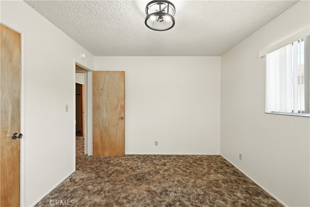 6345 Merced Falls Road Snelling, CA 95369 - Photo 19 of 54 a view of a livingroom with wooden floor and a window