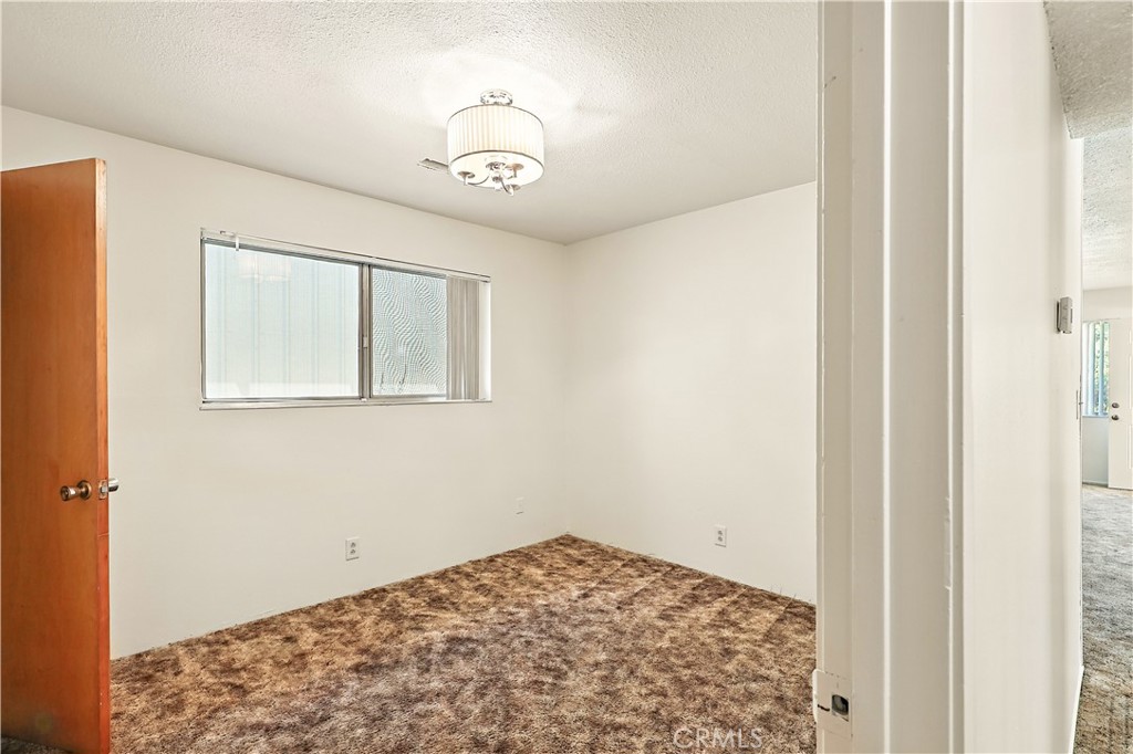 6345 Merced Falls Road Snelling, CA 95369 - Photo 23 of 54 a view of a hallway with a chandelier