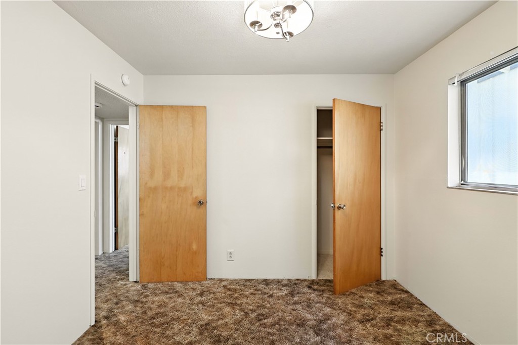 6345 Merced Falls Road Snelling, CA 95369 - Photo 24 of 54 a view of room with window and wooden floor