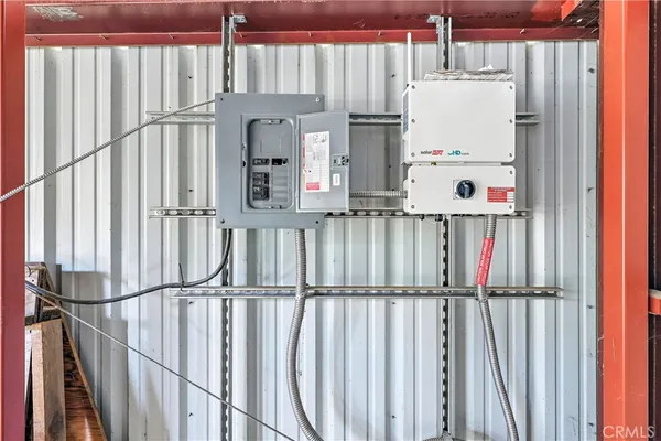 a view of a house with swimming pool and sitting area