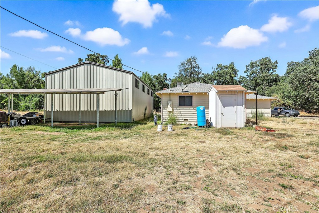 6345 Merced Falls Road Snelling, CA 95369 - Photo 7 of 54 a view of a house with a backyard and a tree