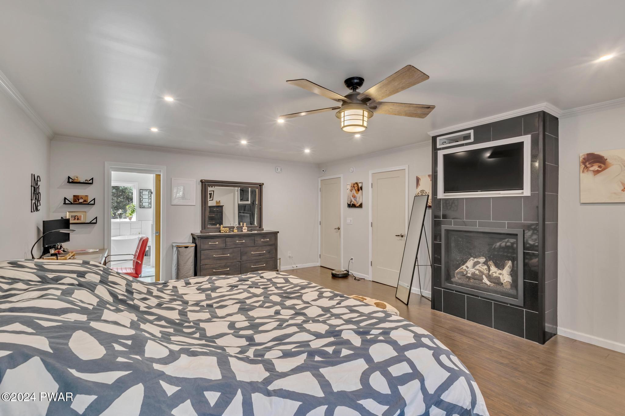 2596 Boulder Road Lake Ariel, PA 18436 - Photo 6 of 57 a bedroom with a bed and a flat screen tv