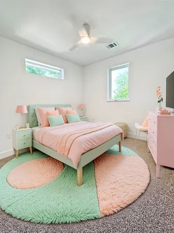 a bedroom with a bed rug and window