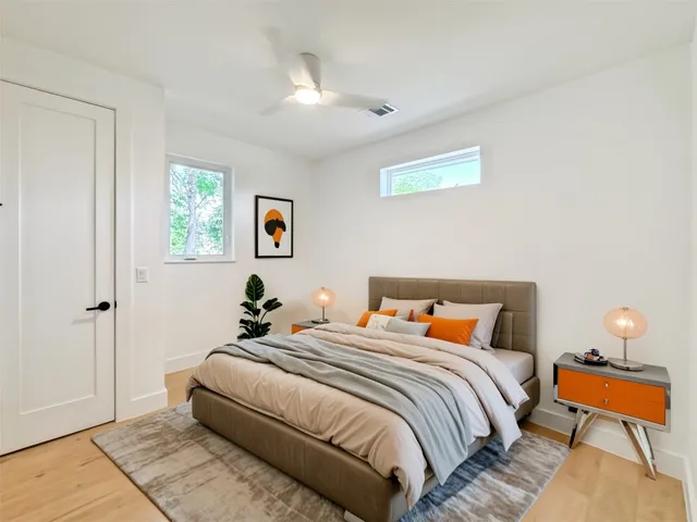 a bedroom with bed and a window