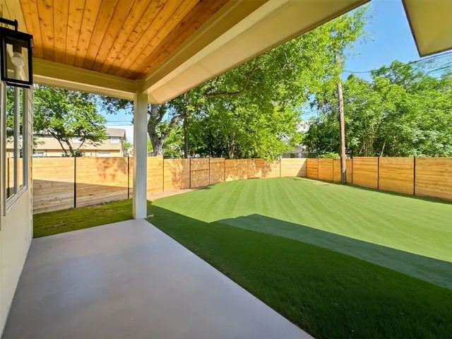 a view of a backyard with porch