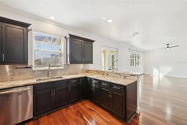 a kitchen with a sink and cabinets