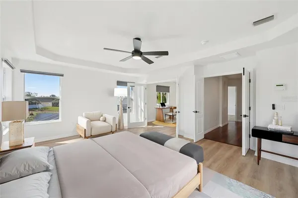a bedroom with furniture and a chandelier