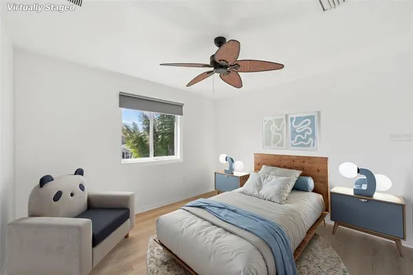 a bedroom with a bed and couch