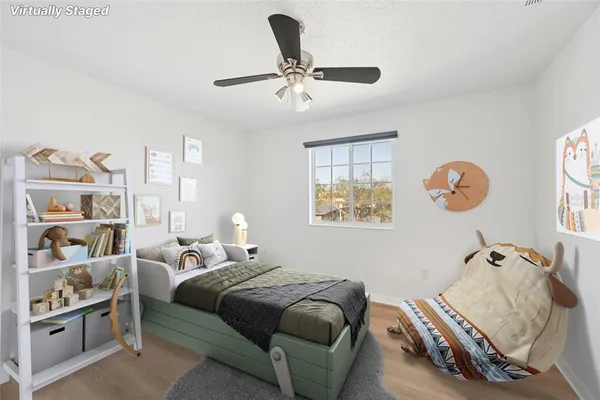 a bedroom with bed and a window