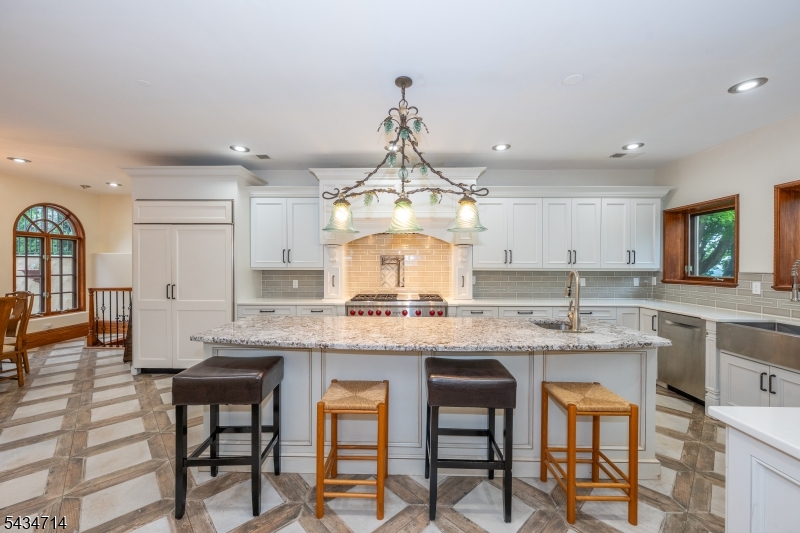 50 Rock Spring Road West Orange, NJ 07052 - Photo 13 of 50 a kitchen with kitchen island granite countertop a table and chairs in it