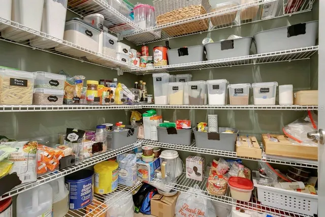 a bathroom with a double vanity sink a mirror and a bathtub