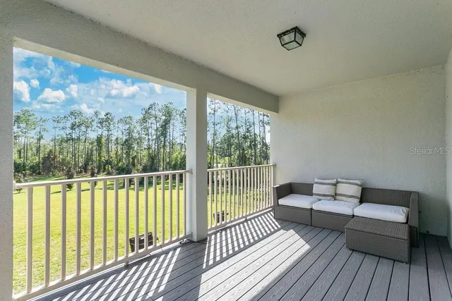 a spacious bedroom with a bed and window