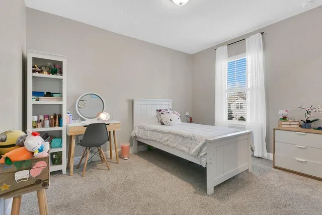 an aerial view of residential houses with outdoor space and swimming pool