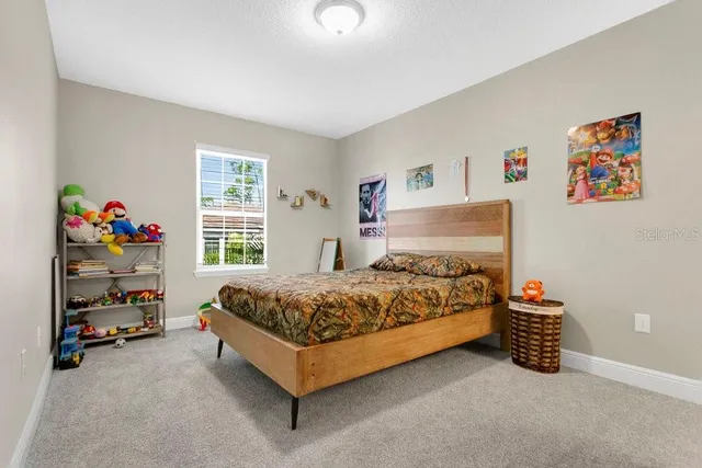 an aerial view of residential houses with outdoor space and swimming pool
