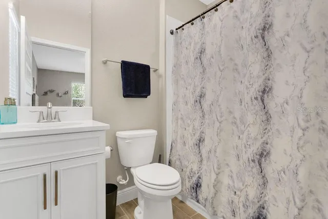 an aerial view of residential house with outdoor space and swimming pool