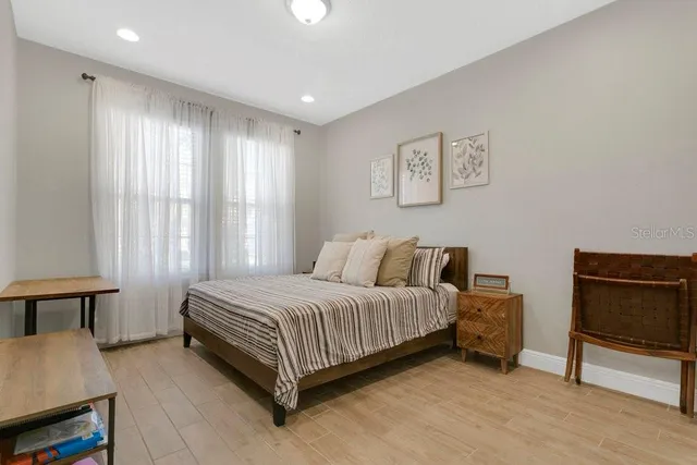 a outdoor space with lots of tables a chairs and a fireplace