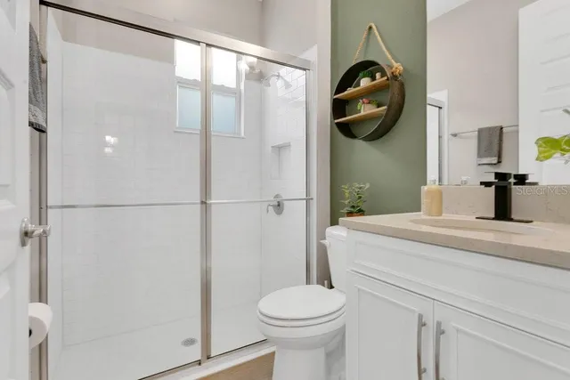 a view of a patio with couches table and chairs and potted plants