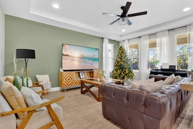 a large kitchen with stainless steel appliances lots of counter space and wooden floor