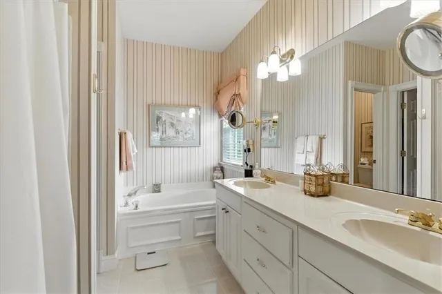 a bathroom with a double vanity sink mirror and double